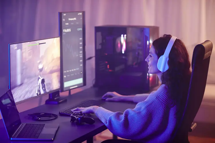 Woman playing GTA 6 on gaming PC at night Ireland
