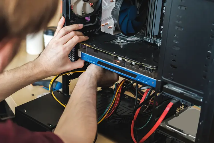 Young man building a PC system Ireland